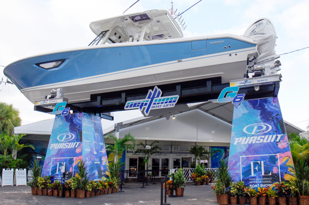 Image of a FLIBS entry point. Display with boat up on lifts to walk under and around. 